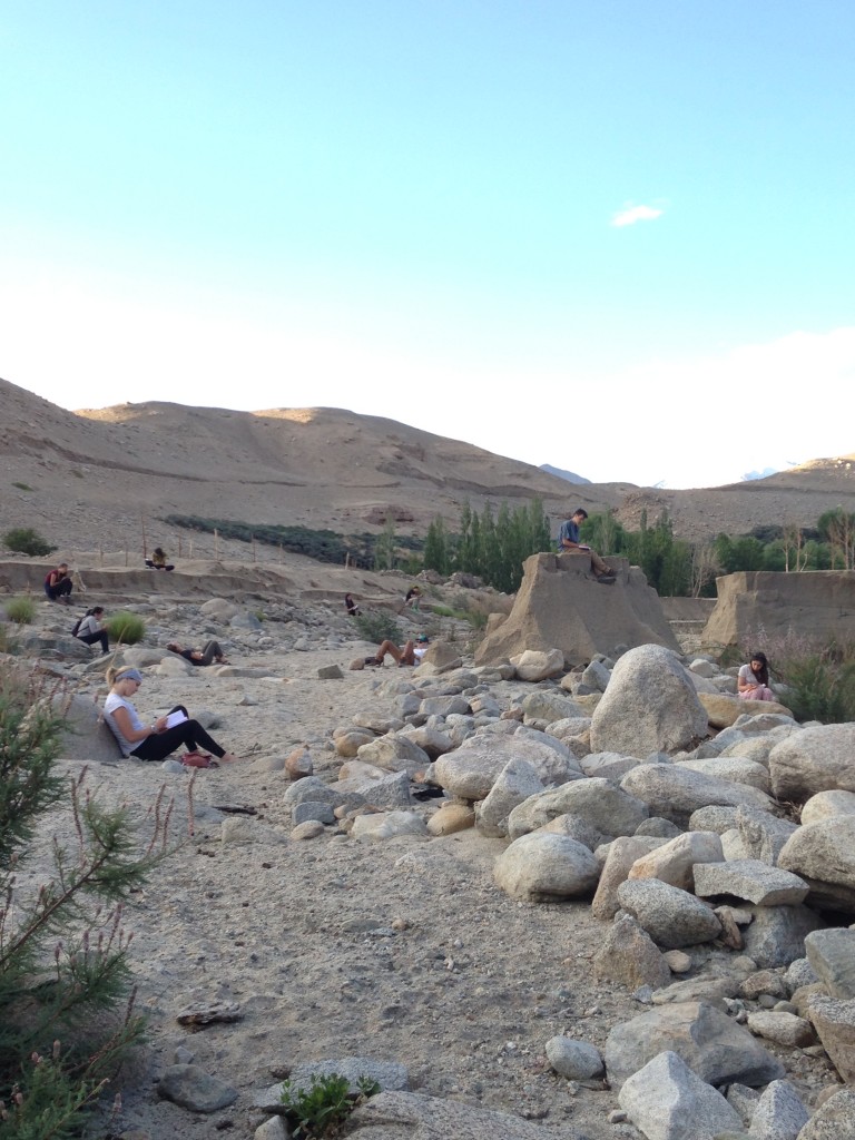 The group journaling on the banks of the Indus River